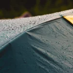 a close up photo of a tent in the rain